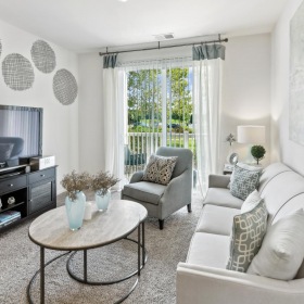 Settle into comfort at Addison Court a living room with a tv and couches